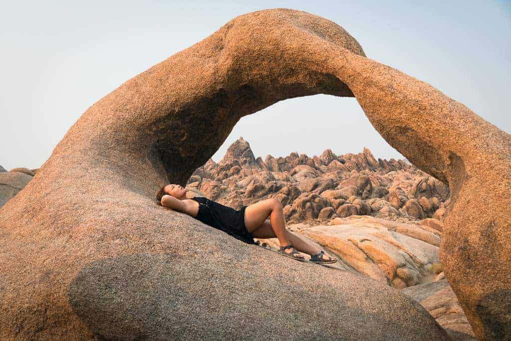 Cat Xu Chilling at Mobius Arch in Alabama Hills on a california desert road trip