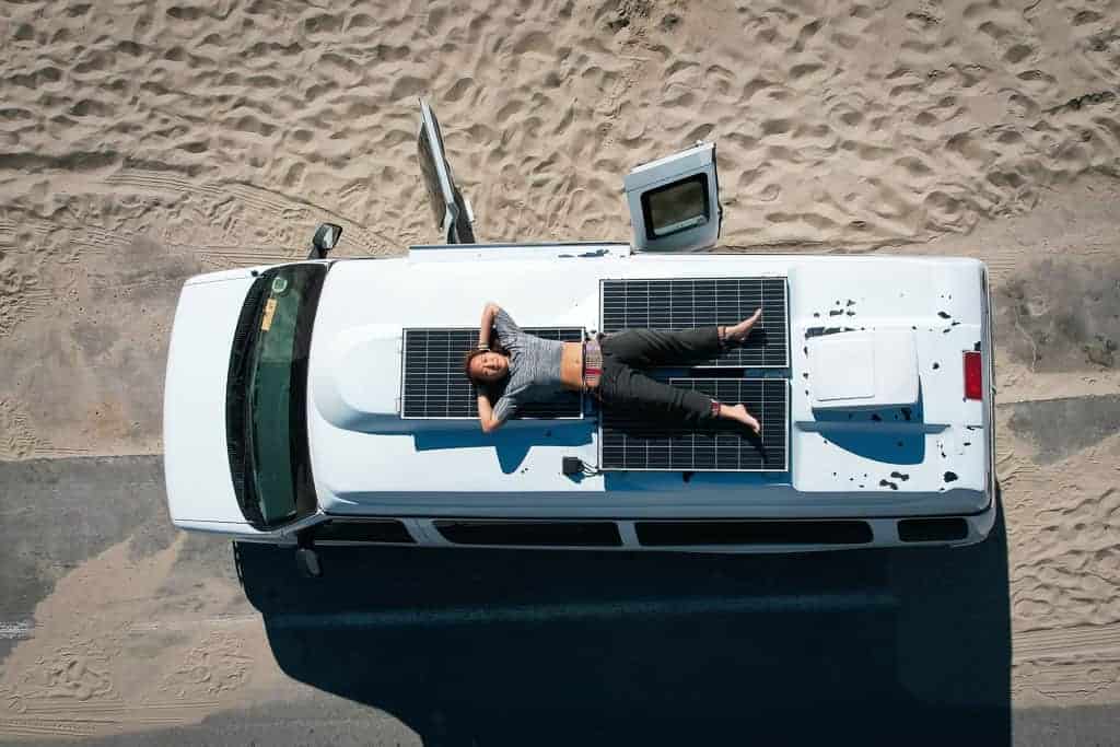 Cat Xu lying on a camper van