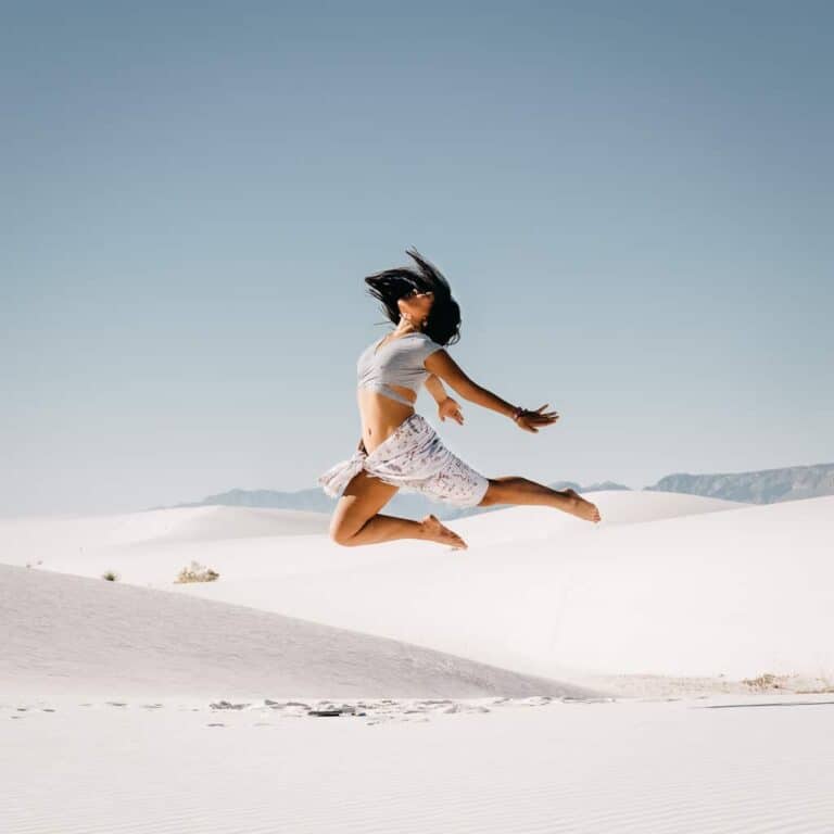 White Sands National Park portrait cat xu jumping in the white sand dunes in the day time