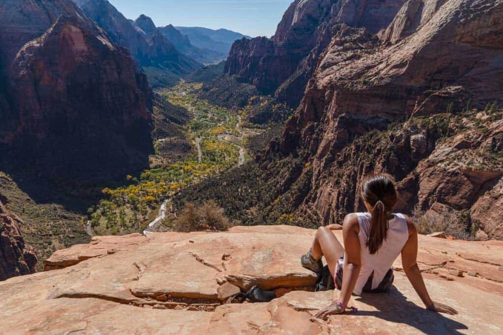 catherine xu at the top of Angel's Landing Summit at Zion National Park on a road trip from Las Vegas to page az