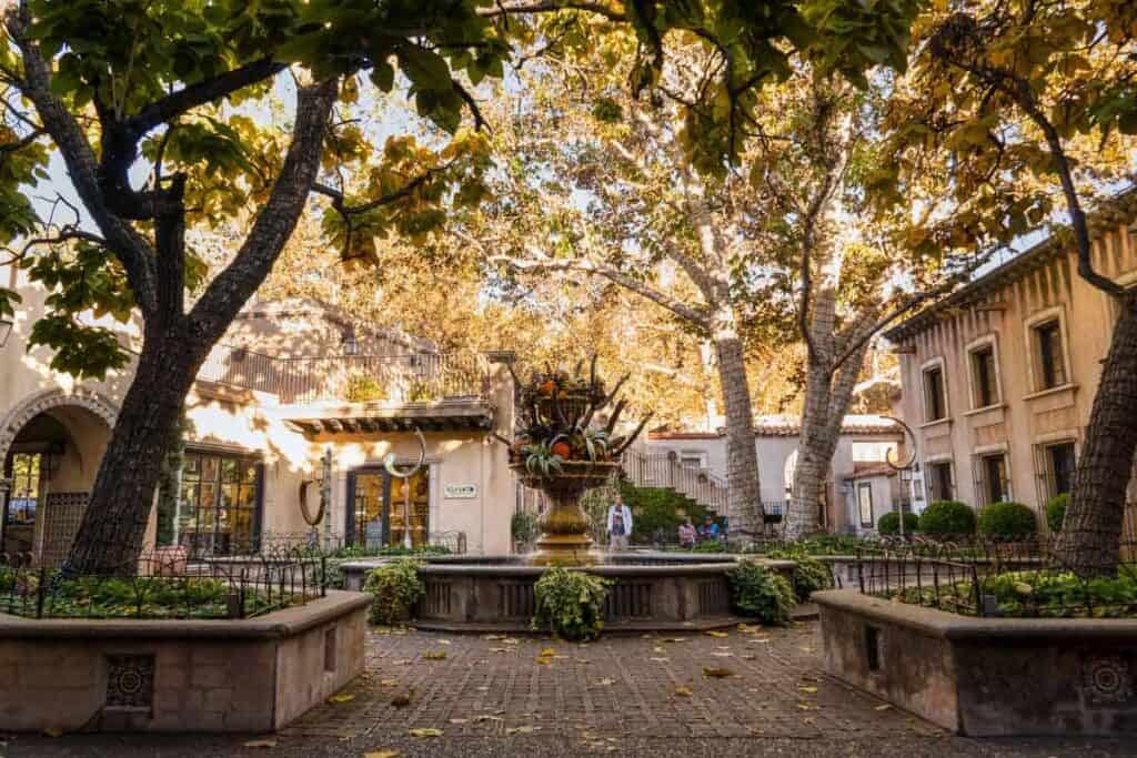 A courtyard at Tlaquepaque Arts & Shopping Village in the best time to visit Sedona, the fall for the colorful foliage