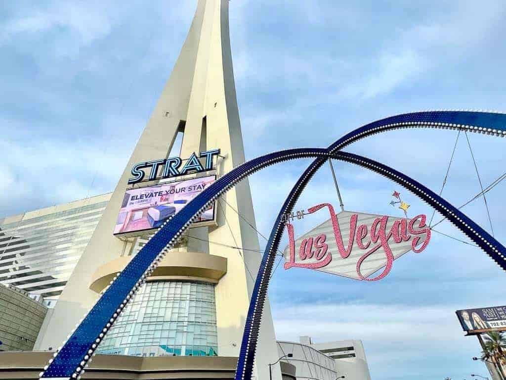 the strat and the las vegas iconic sign, a stop of a las vegas food tour