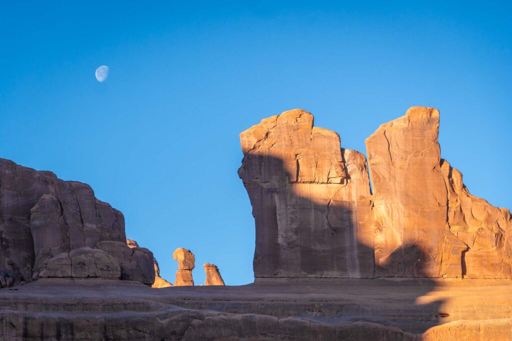 courthouse butte monoliths underneath a day time mood and half in shadow