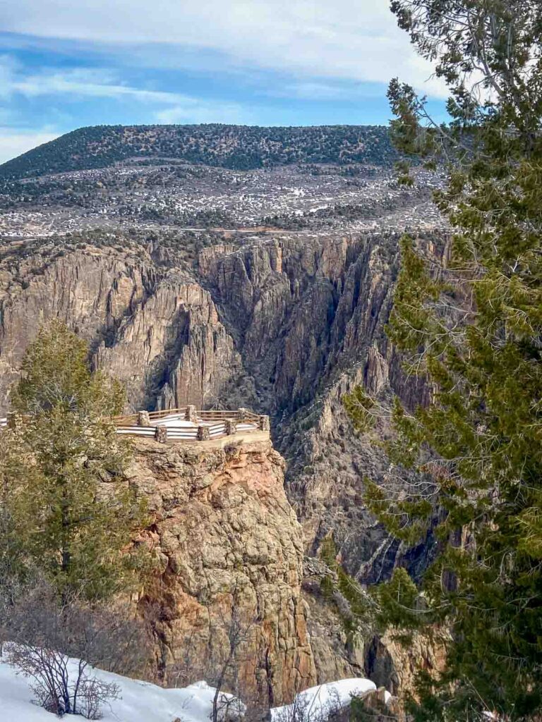 An overlook over the dramatic cliffs, the first stop on a one day in Black Canyon national park itinerary