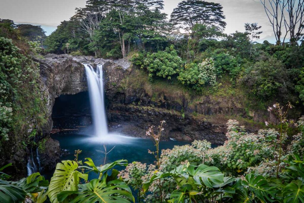 rainbow falls near hilo with a long-exposire flowing into water basin