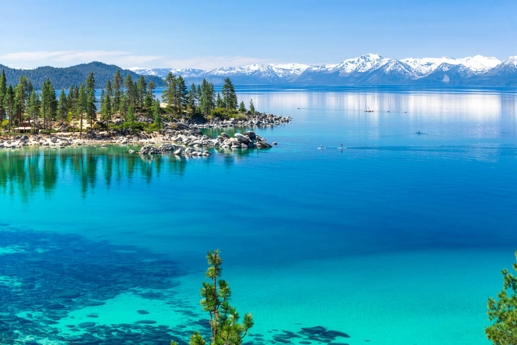 Blue waters of Lake Tahoe beach with the sierra mevadas in the background