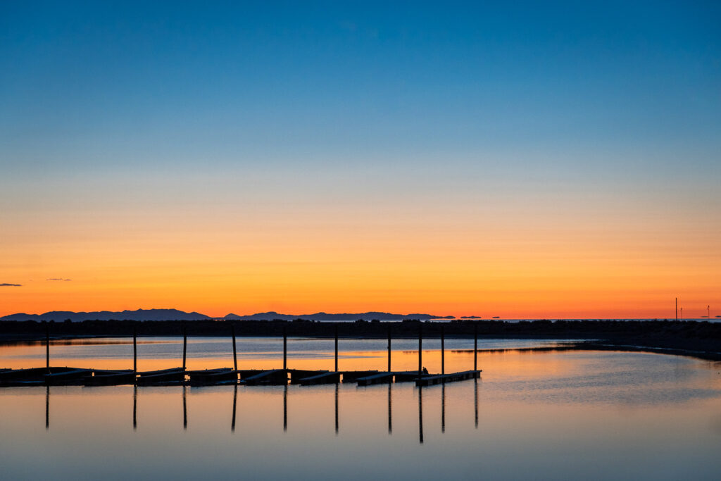 the great salt lake in sunset lighting with a boardwalk