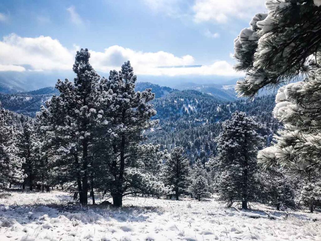 The summit of the snowy Boulder's Lions Spur Trail of the flatirons