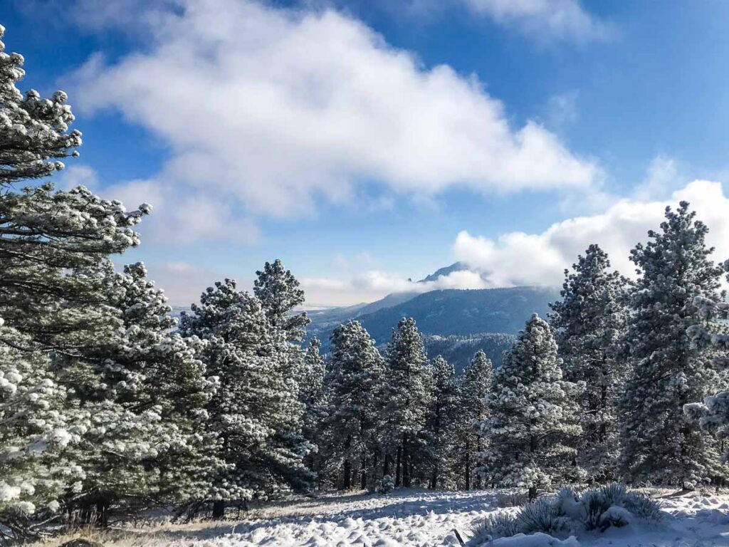 Hiking in the mountains on a day trip to Boulder from Denver in the winter