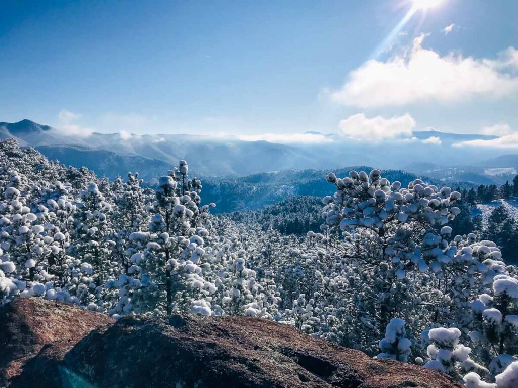 The summit of the snowy Boulder's Lions Spur Trail of the flatirons