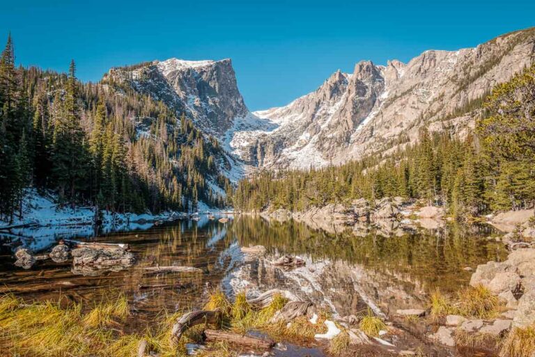 Dream Lake and reflection with mountains in snow around at autumn. Rocky Mountain National Park in Colorado, USA.