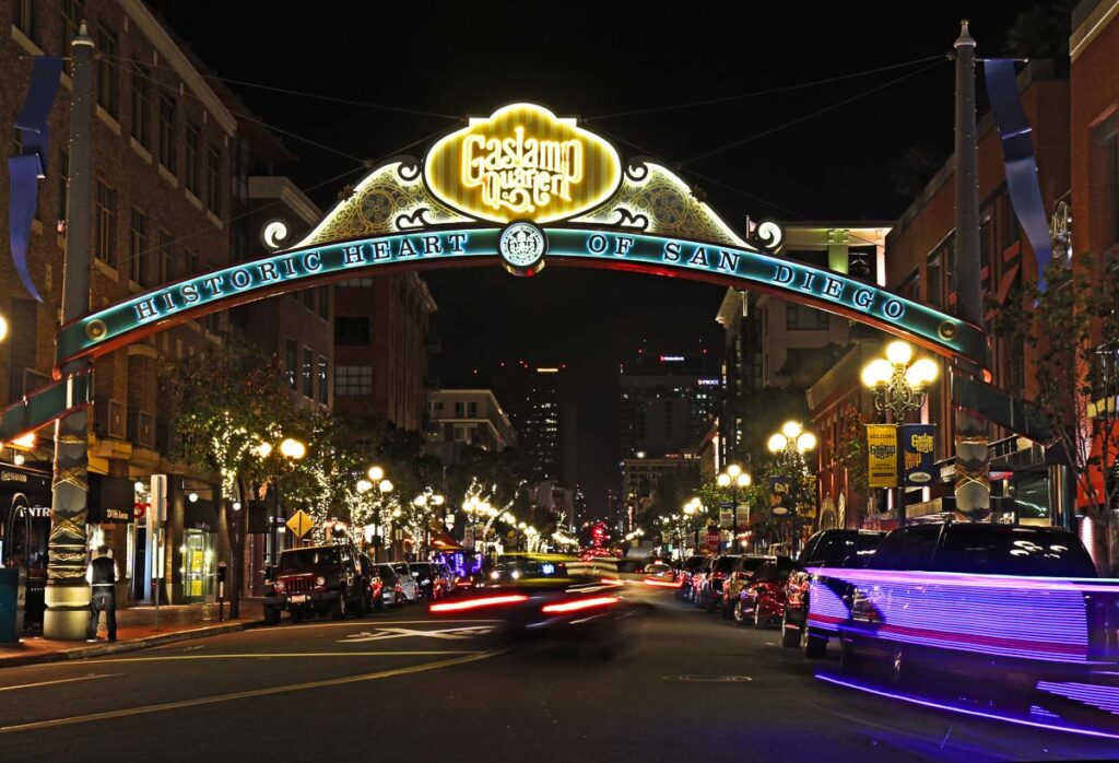 Entrance sign to the Gaslamp Quarter Historic District at night. This 16.5-block neighborhood hosts numerous festivals and is a popular tourist destination.