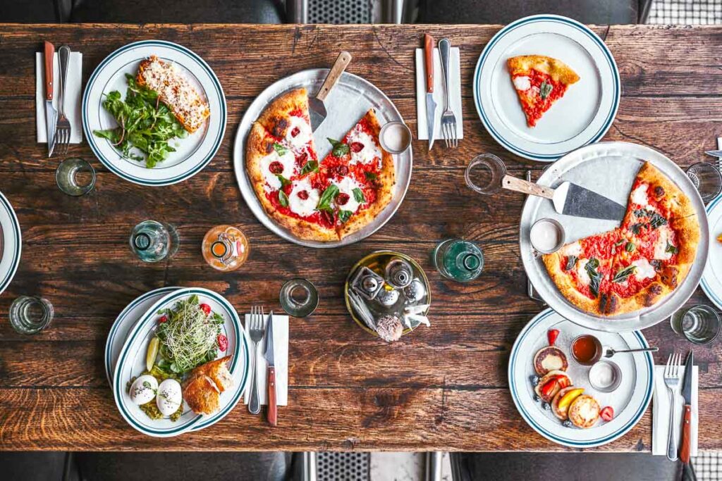 Various italian food on a wooden table