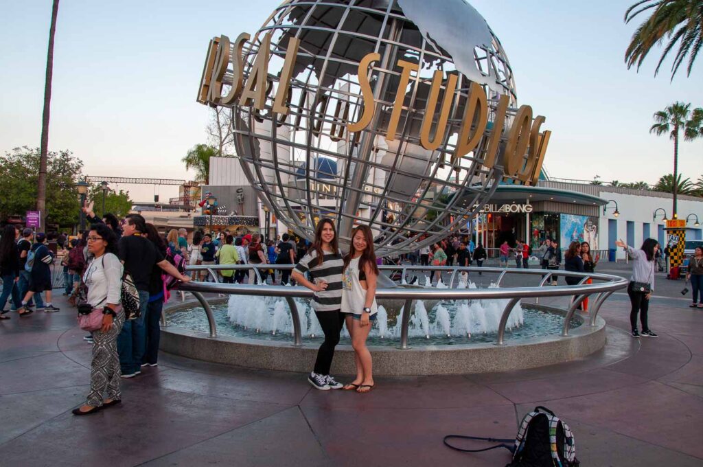 Cat Xu standing in front of Universal Globe in Los Angeles