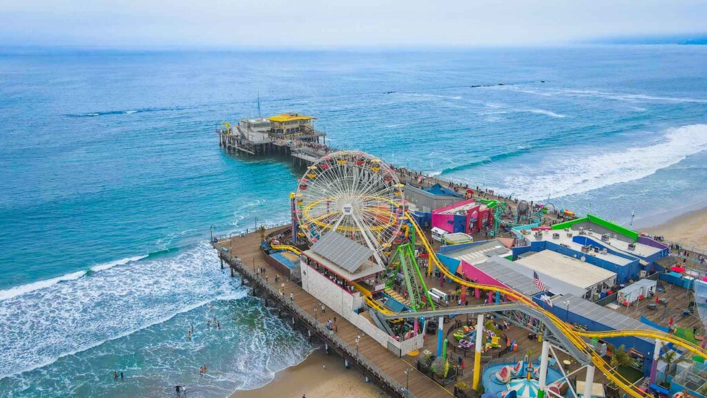 Aerial footage of Santa Monica Pier and the Pacific Ocean