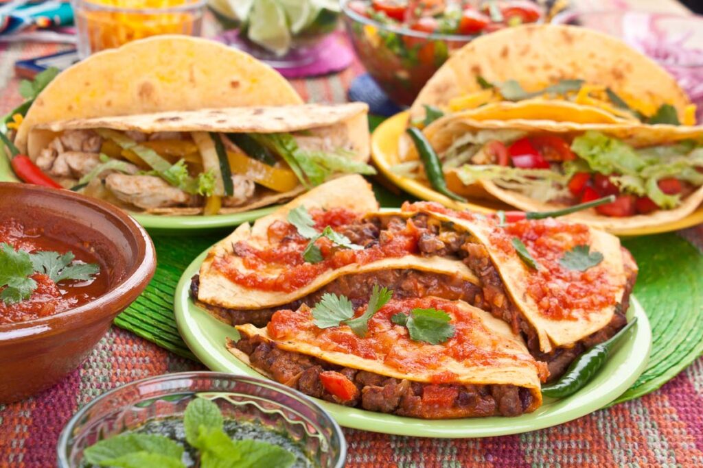 Traditional Mexican food on colorful plates on a san diego food tour