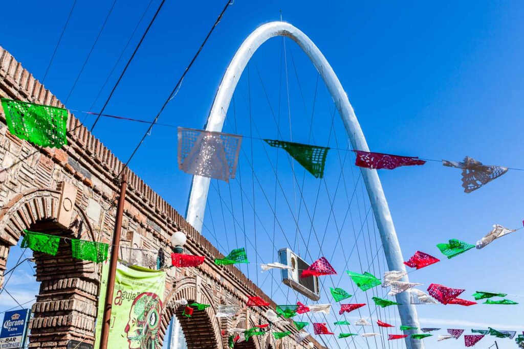 Tijuana Arch with Mexican Flags on a clear day