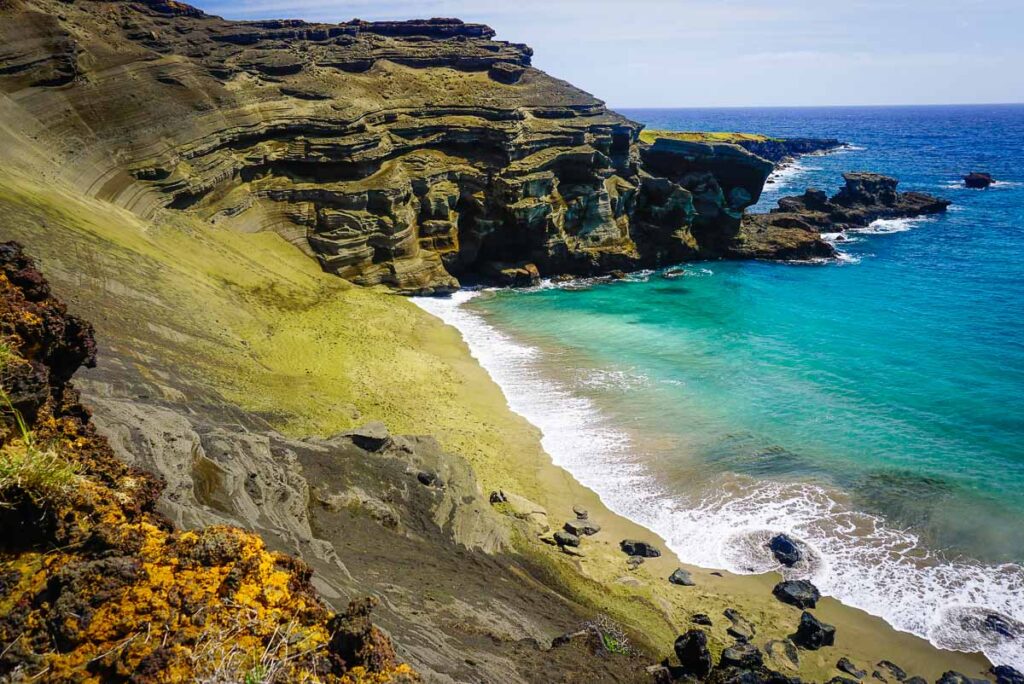 Papakōlea Green Sand Beach with blue waters during the best time to visit Big Island Hawaii