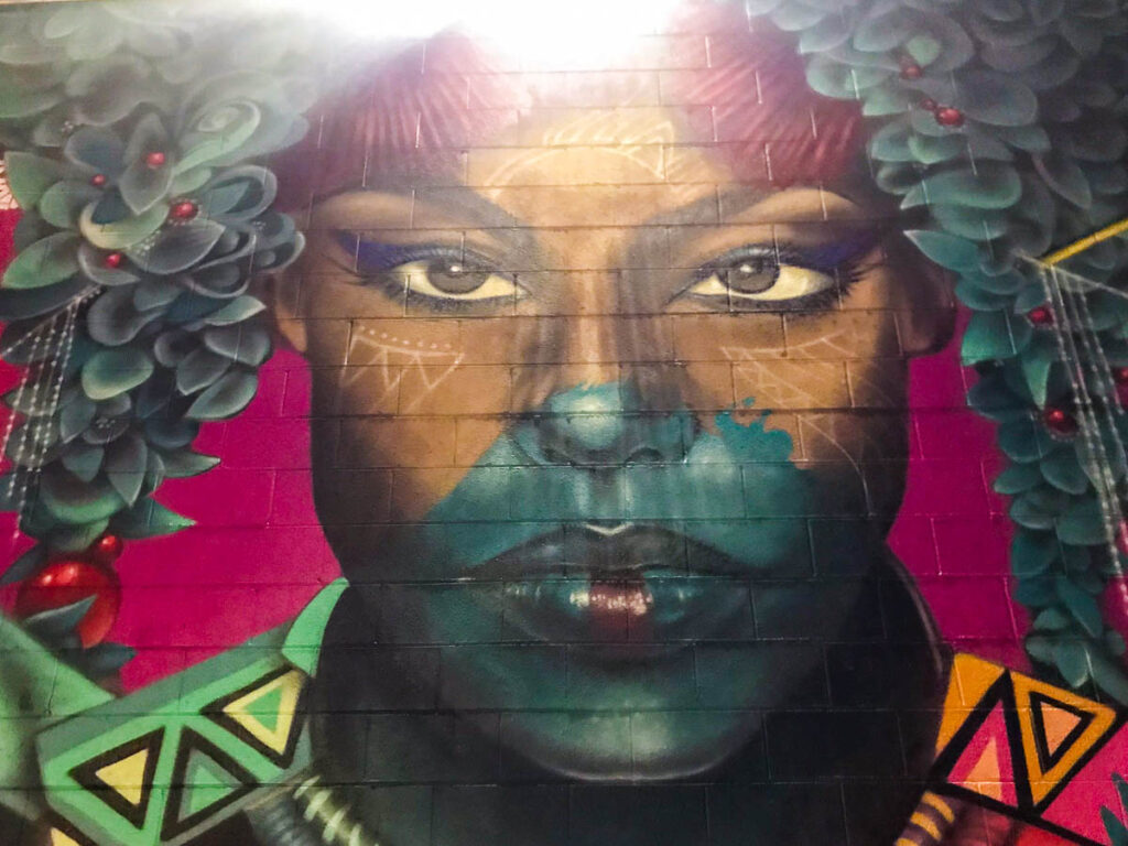 denver street art of a colorful women graffiti