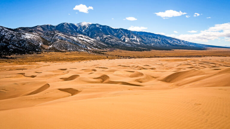 Sand Dunes Leading to the Mountains in Great Sand Dunes National Park in Colorado