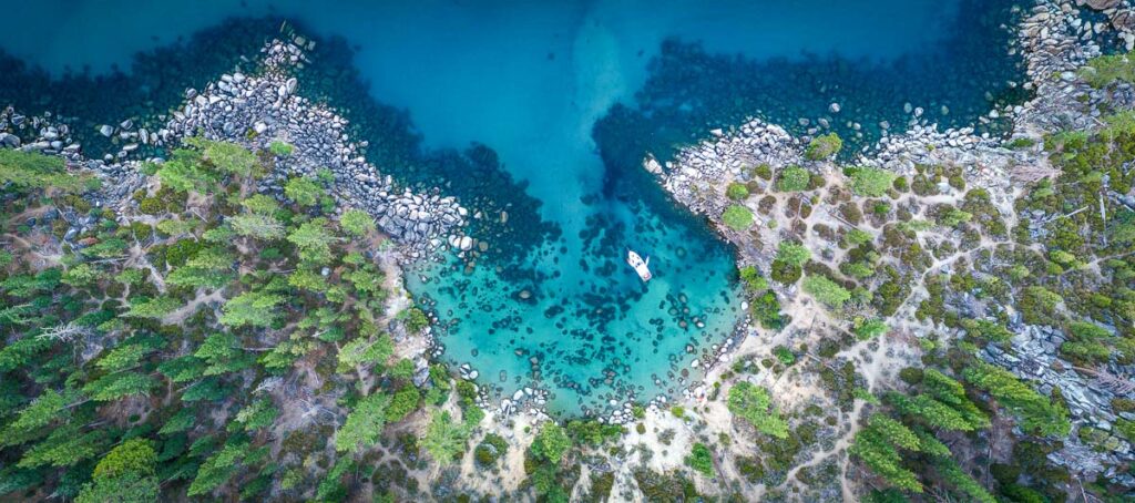 lake tahoe aerial shot of boat on bay