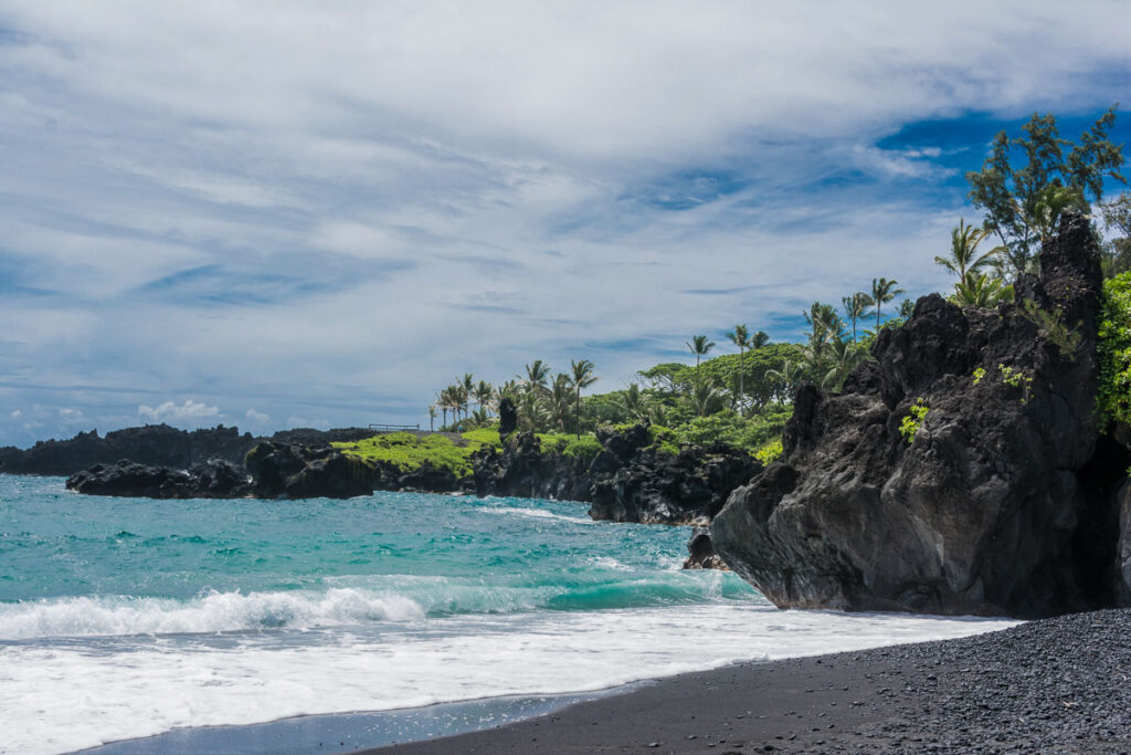 Small blue waves hitting Black Sand Beach on East Maui
