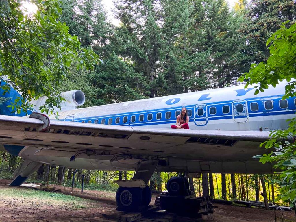 Catherine Xu sitting on top of plane house just outside Portland oregon