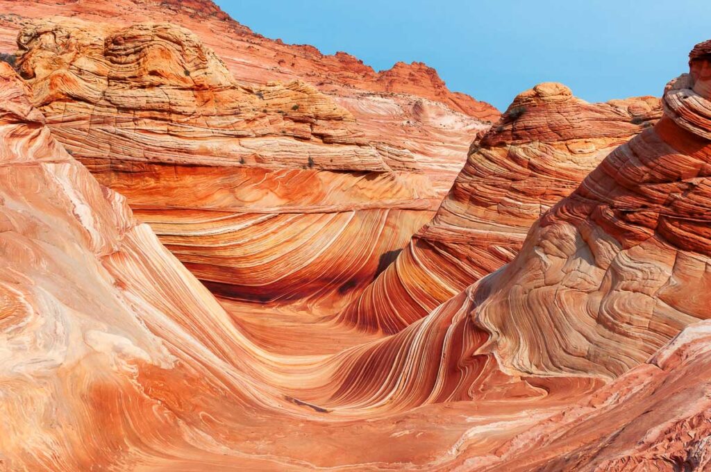 The smooth sandstone layers in Arizona The Wave Hike, one of the hardest national park lotteries to win