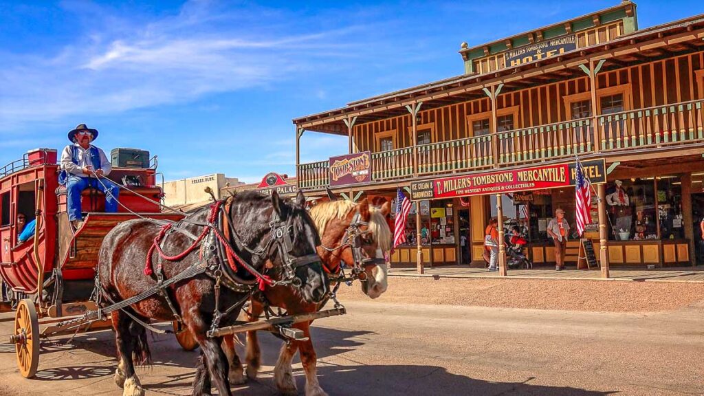 Stagecoach filled with tourists rolls down the streets of the wild west town of Tombstone, Arizona