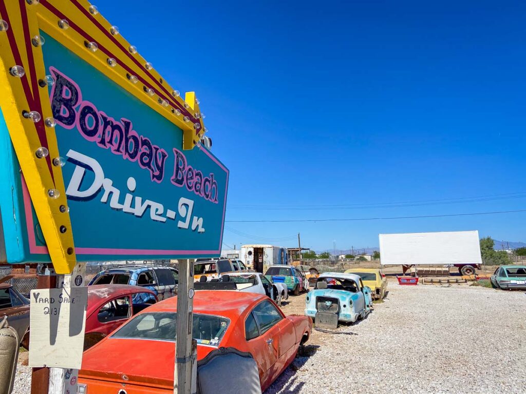 The Bombay Drive-In art installation with empty cars, one of the weirdest roadside attractions in the West USA
