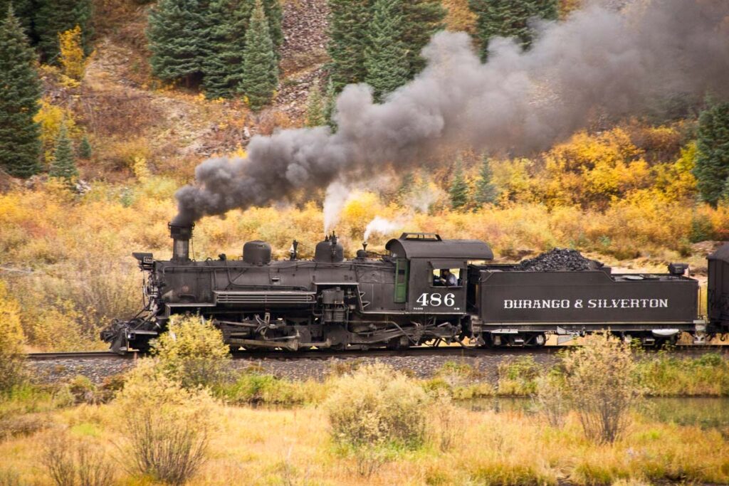 The Durango and Silvertaon narrow guage railroad carries passengers through Rocky Mountain high country amid the fall colors.