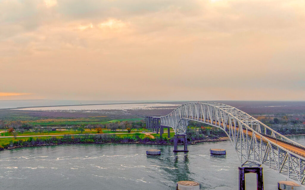 Aerial view of the Port Arthur Bridge during the sunset