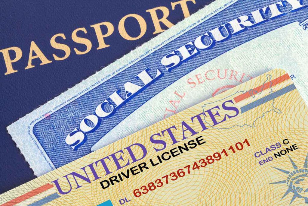 Driver's license social security and passport stacked on top of each other