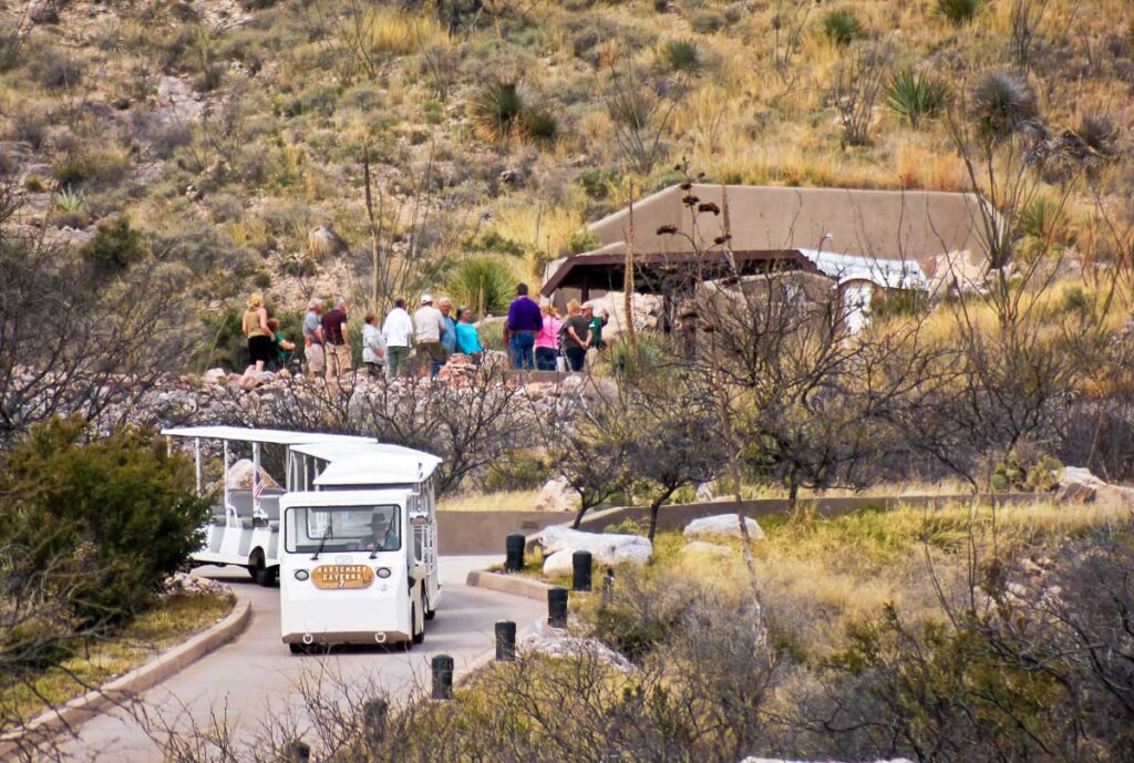 A shuttle bus drops a group of tourists at the cave entrance for a tour of Kartchner Caverns near Benson in Arizona.