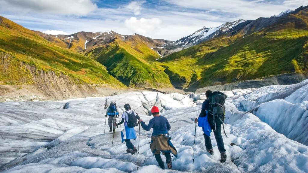 Tourists hiking a glacier in Alaska, Wrangell-St. Elias National Park