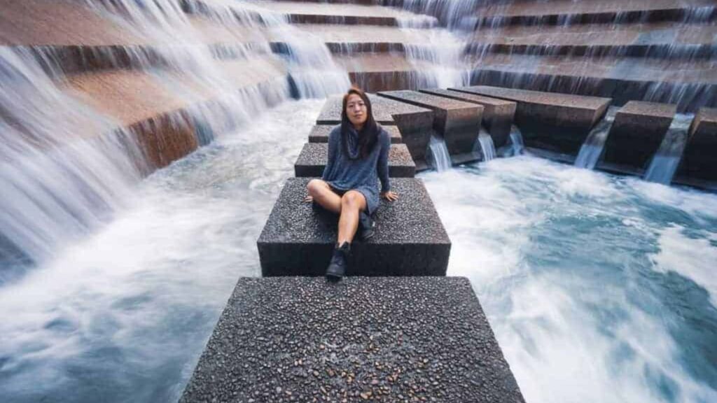 Catherine Xu sitting at fort forth water gardens