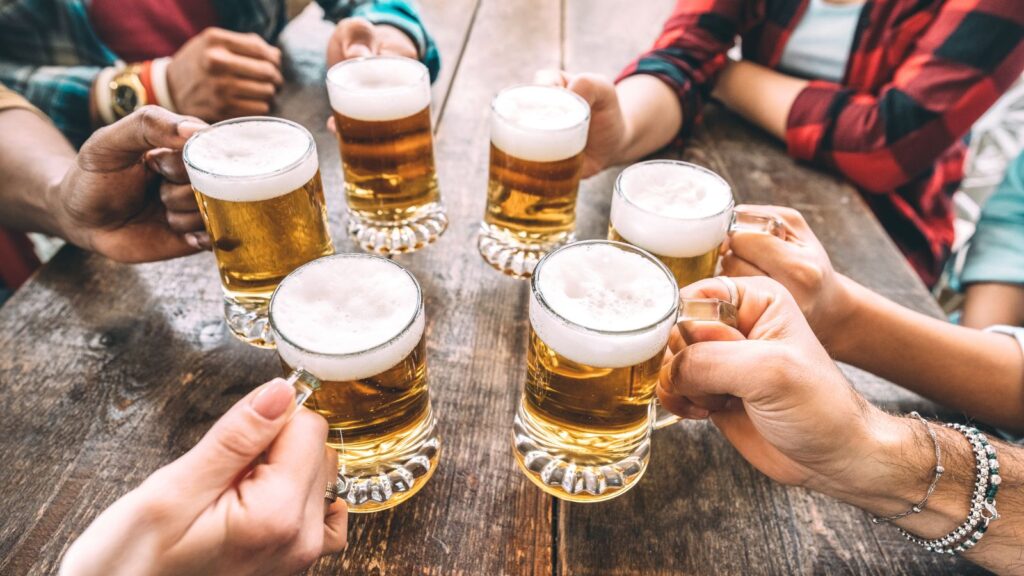 Group of Friends Hands Cheering with Beers