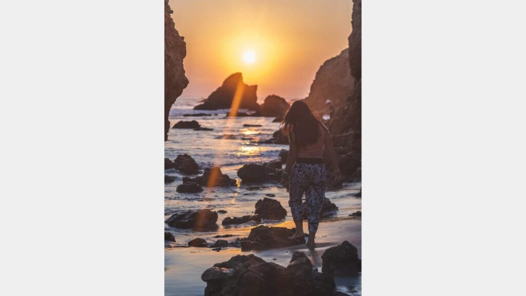 Catherine Xu on matador beach malibu during the sunset