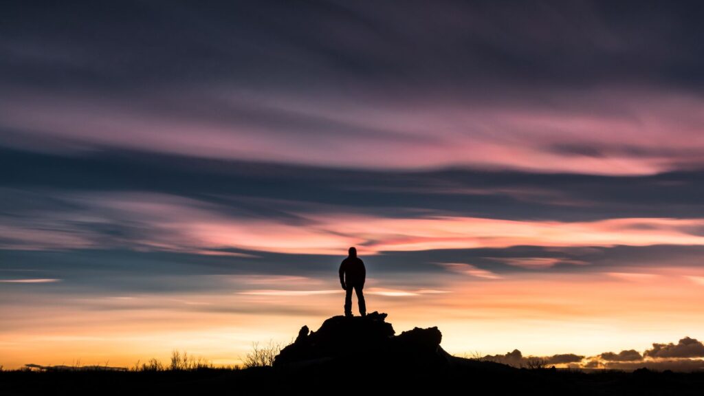 Nacreous Clouds with silhouette of a man