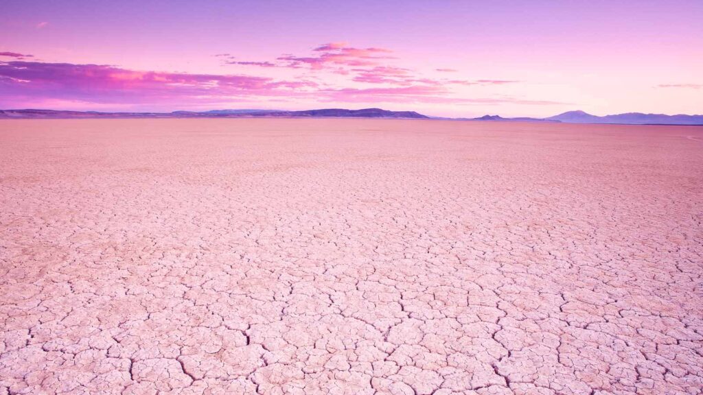 Purple glow at sunset on Alvord Desert dry lakebed in southeastern Oregon, USA