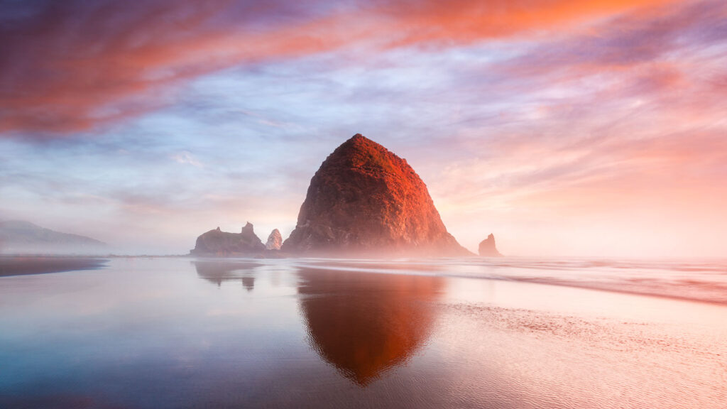 The Sunset at Cannon Beach with Dramatic clouds in the background