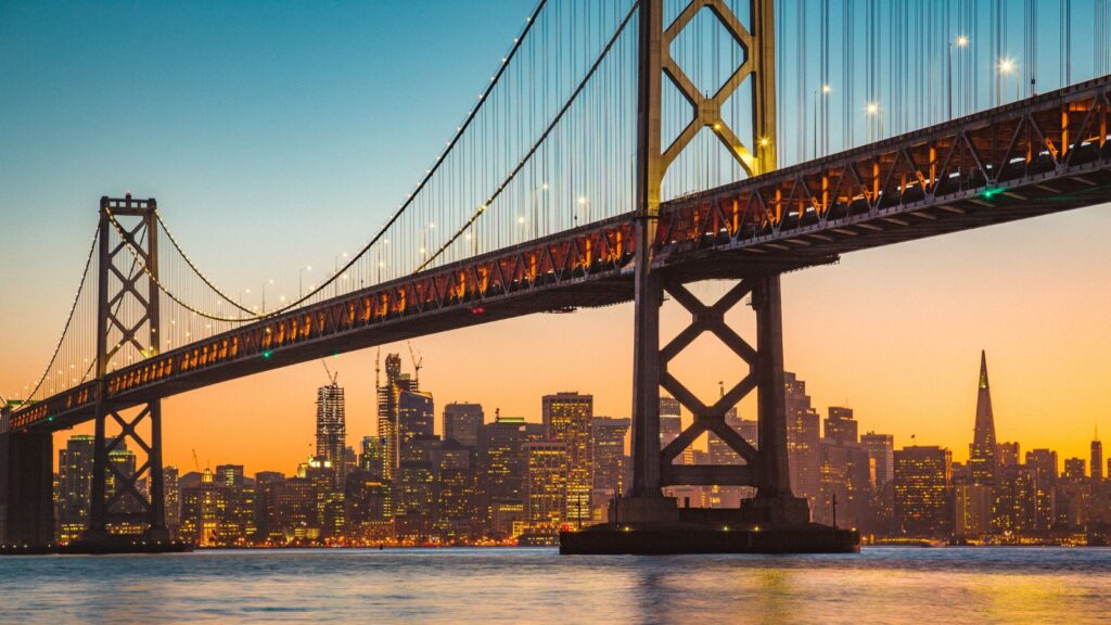 California, San Francisco skyline with Oakland Bay Bridge at sunset