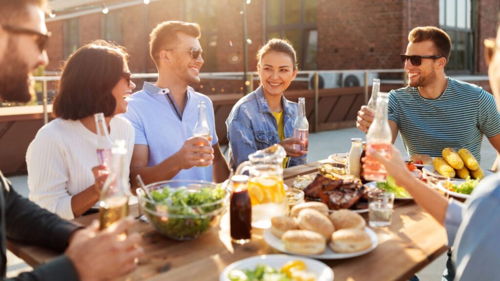 friends having a gathering with appetizers on the table