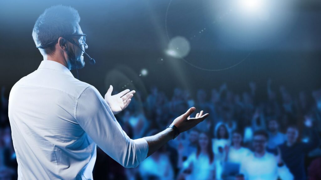 Motivational Speaker with Headset Performing on Stage