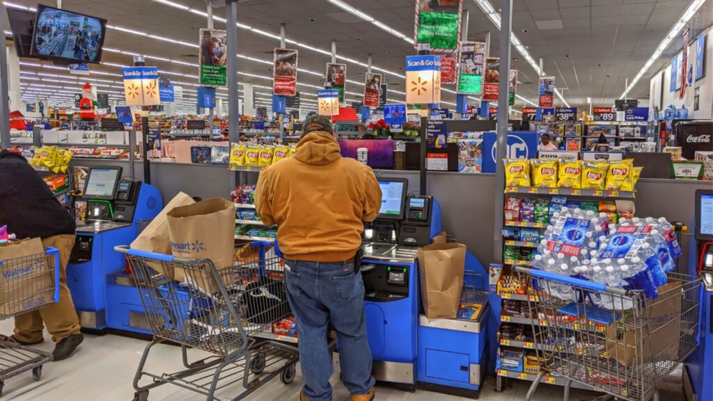 customer waiting for his purchases to be bagged