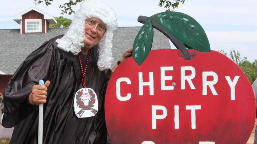 Well Dressed Judge At Cherry Pit Spit Contest