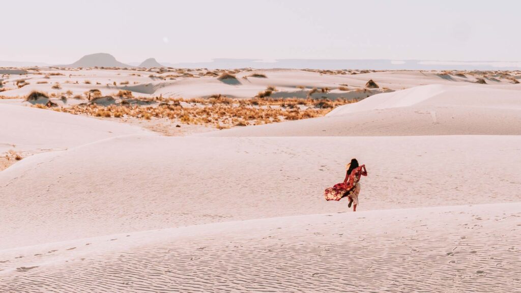 Cat Xu in distance in the dunes of White Sands National Park