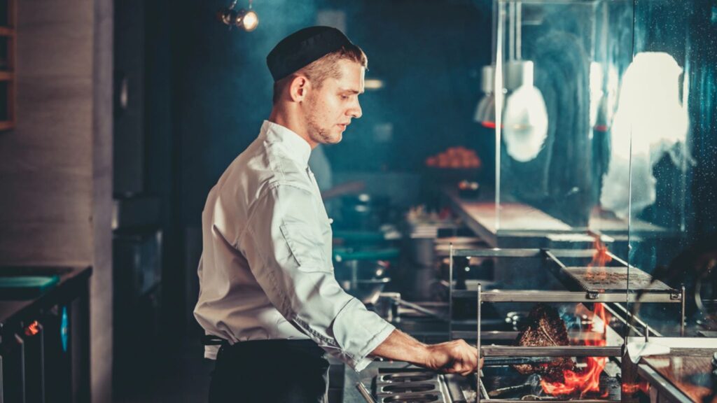 chef grilling traditional beef steak