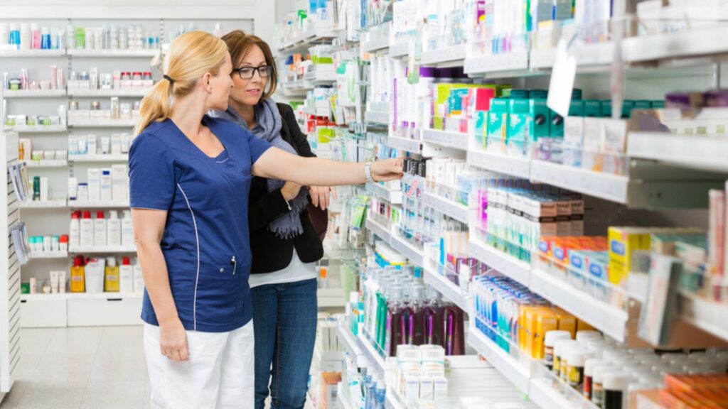 pharmacist assisting customer