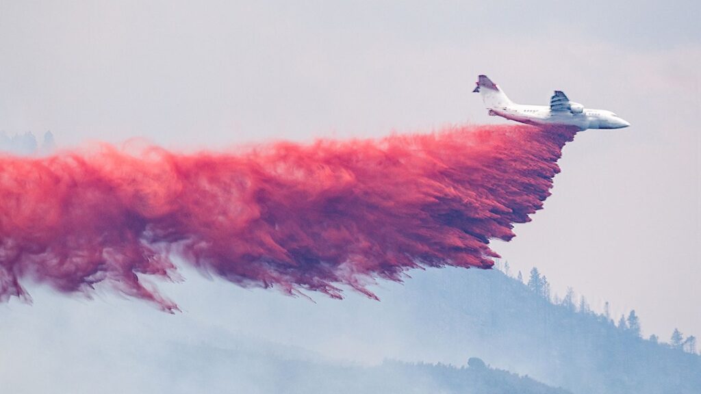 Plane Through Anti Wildfire Powder